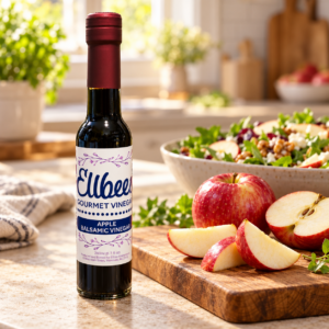 Ellbee’s Apple Balsamic Vinegar bottle with serving suggestions on a kitchen countertop